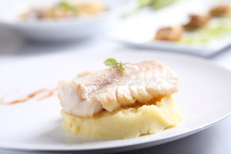 Sea Bass Fillet in Tempura on a Pad of Rice Noodles with Shitaki, Spinach, Cream and Unagi Sauce