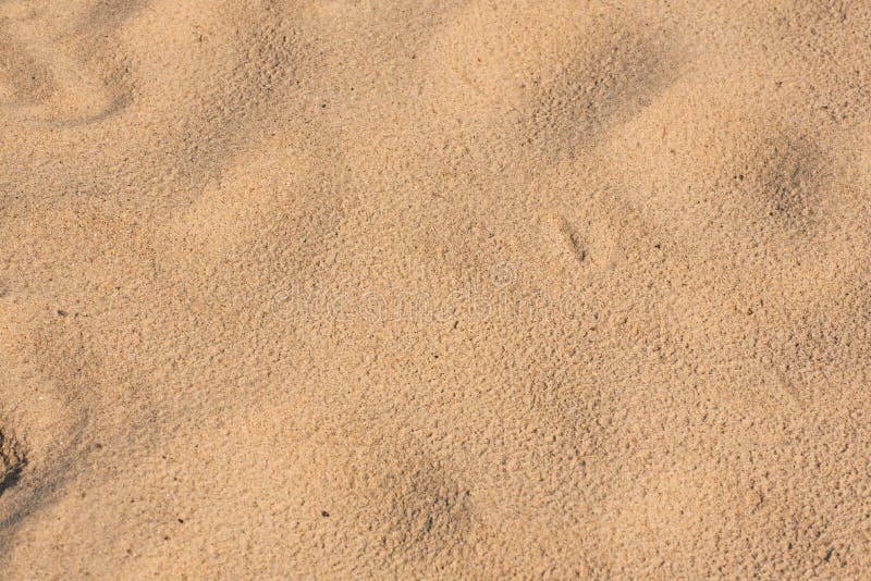 Sea beach or desert sand close up. Summer background. Concept of travel, vocation, relax stock image