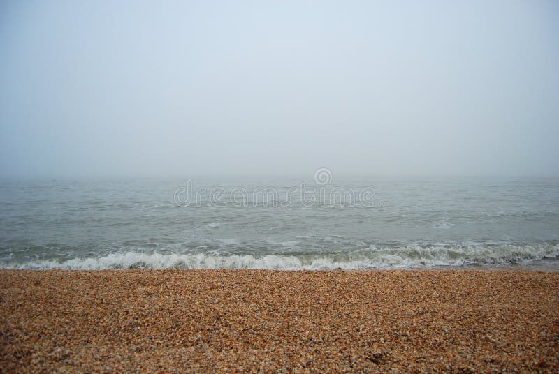 Sea beach in heavy fog