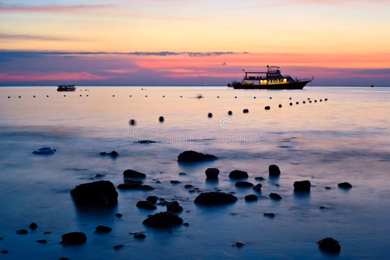 Sea and boat landscape at sunset time