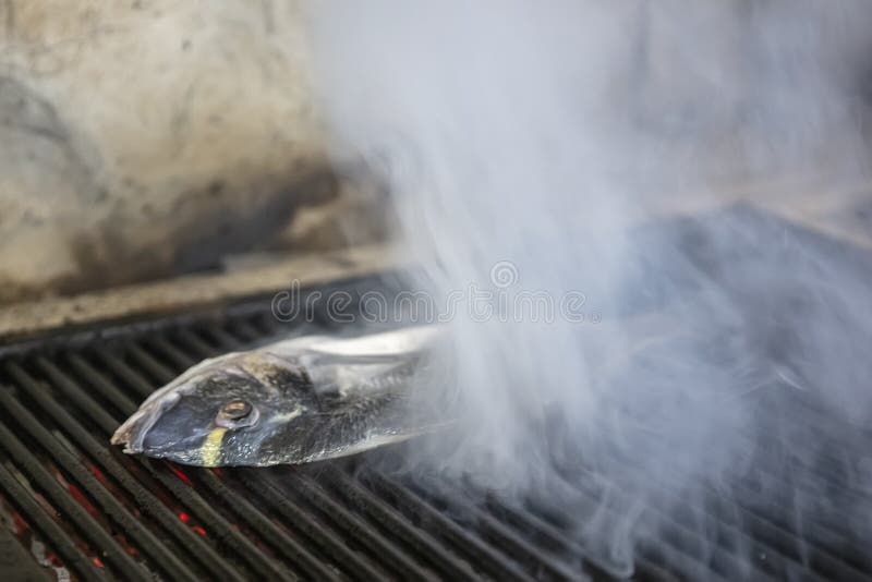 Sea Bream Fish on the Grill. Grilled Fish Dish Sea Bream Restaurant