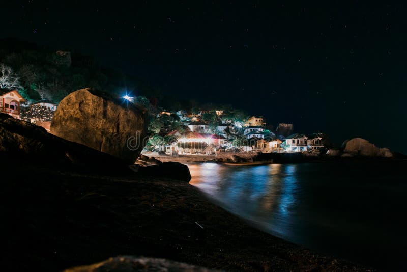 Sea and bungalows during the night stock image Sea and bungalows during the night stock image
