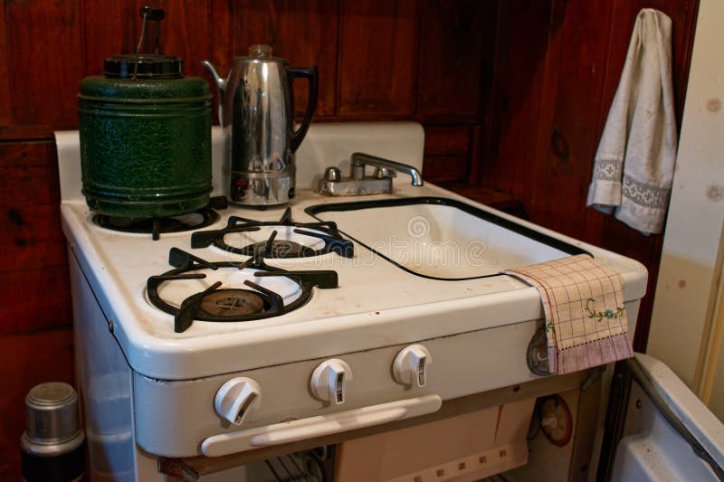 The kitchen of a salvaged cottage built in 1938 originally part of a motel at Hampton Beach known as the Sea Castle Motel displaying a unique combination of stove, refrigerator, and sink at the Tuck Museum of Hampton History. Hampton, New Hampshire. The kitchen of a salvaged cottage built in 1938 originally part of a motel at Hampton Beach known as the Sea Castle Motel displaying a unique combination of stove, refrigerator, and sink at the Tuck Museum of Hampton History. Hampton, New Hampshire