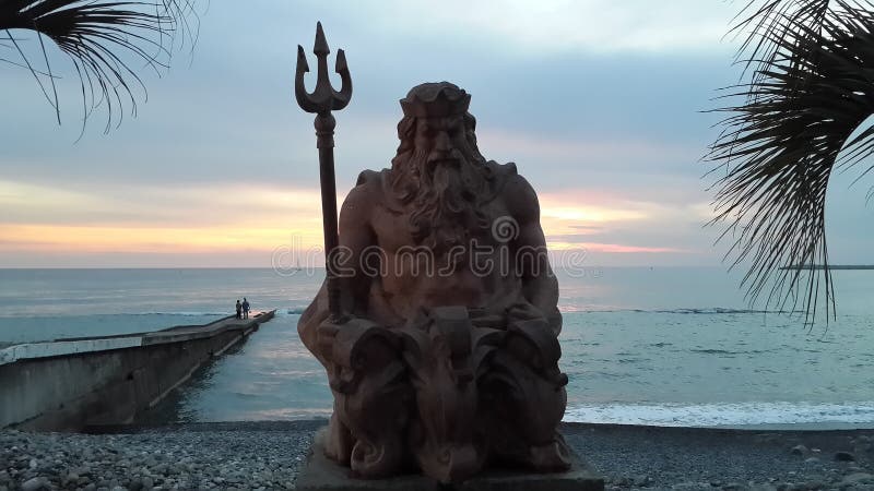 Sea god Neptune at sunset, Sochi resort stock photo Sea god Neptune at sunset, Sochi resort stock photo