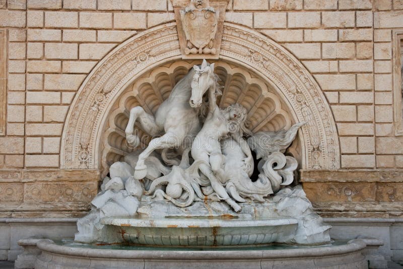 Sea horse and fallen rider sculpture. Bologna