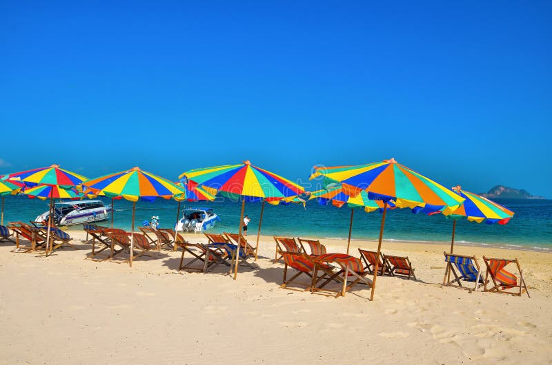 Sea,Island,umbrella,Thailand, Khai Island Phuket, Sun beds and sun umbrellas on a tropical beach royalty free stock photo Sea,Island,umbrella,Thailand, Khai Island Phuket, Sun beds and sun umbrellas on a tropical beach royalty free stock photo
