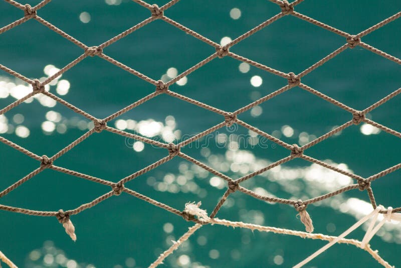 SEA NET with SEA in the BACKGROUND Stock Photo Image of coast, close