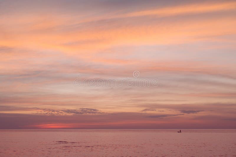Sea pink sunset. Beautiful color clouds. stock photos