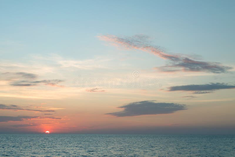 Sea pink sunset. Beautiful color clouds. stock photos