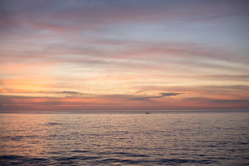 Sea pink sunset. Beautiful color clouds. stock photo