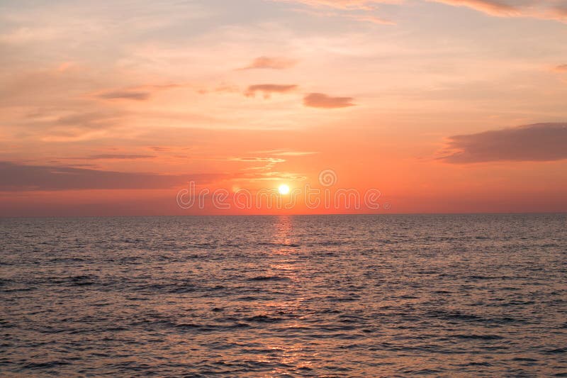 Sea pink sunset. Beautiful color clouds. stock photos