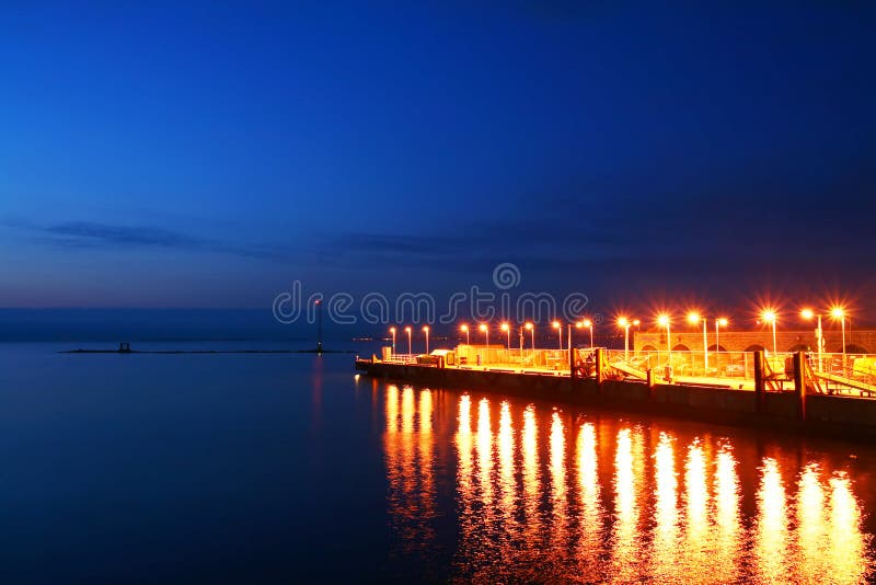 Sea quay at night.