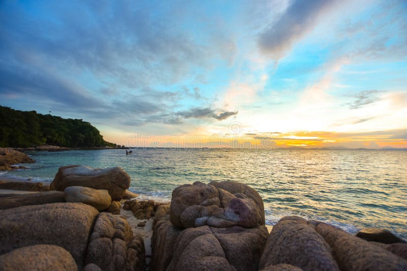 Sea and rock stones on the beach with sand in sunset.,nature sea scene and landscape photography, Sunset at peaceful Rock Beach