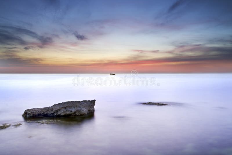 Sea and rock at the sunset.