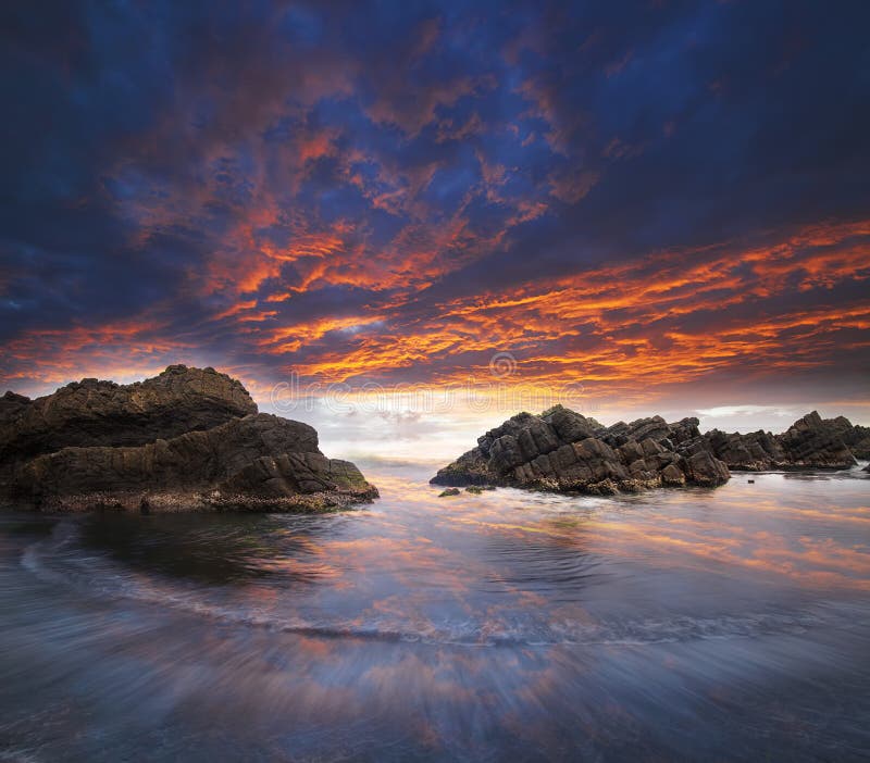 Sea and rock at the sunset. Nature