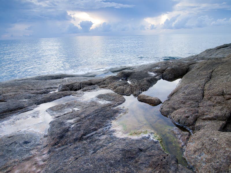 Sea and rock at the sunsetat the sunset