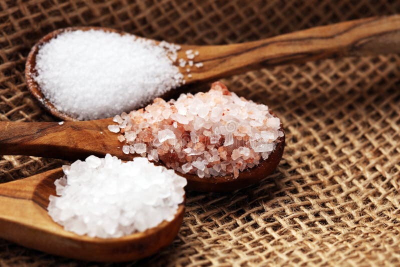 Sea Salt and Himalayan on Spoon. Crystals of Salt on Background Stock Photo Image of pink