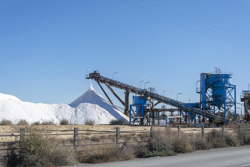 Conveyor Forming a Huge Pile of Salt. Sea Salt Production and Storage