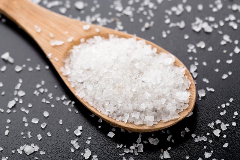 Sea salt in wooden spoon