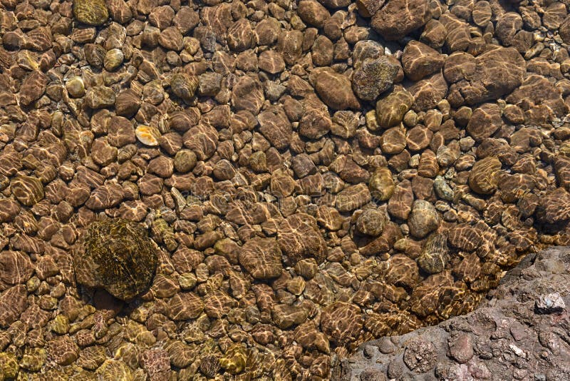 Sea stones in the ocean close background stock images
