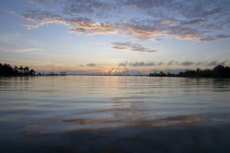 Sea Under the Scattered Clouds at Sunset in Laguna De Bacalar