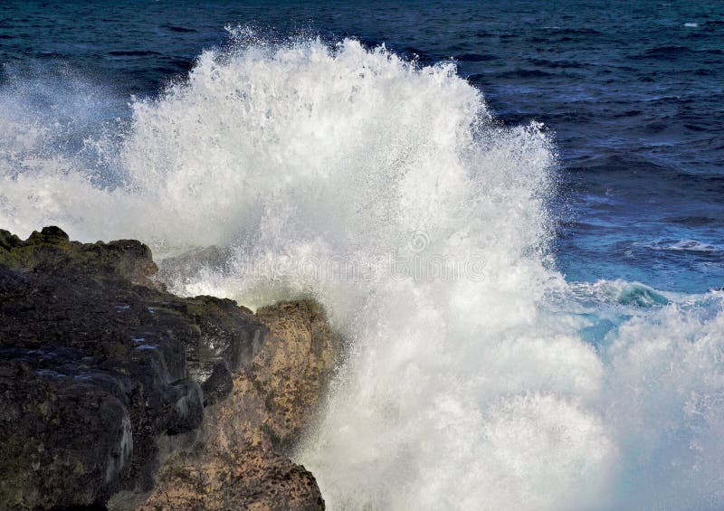 Sea wave explosion on rocks in the ocean