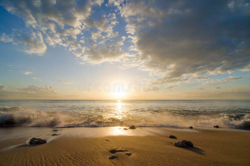 Sea wave at sunset royalty free stock photography