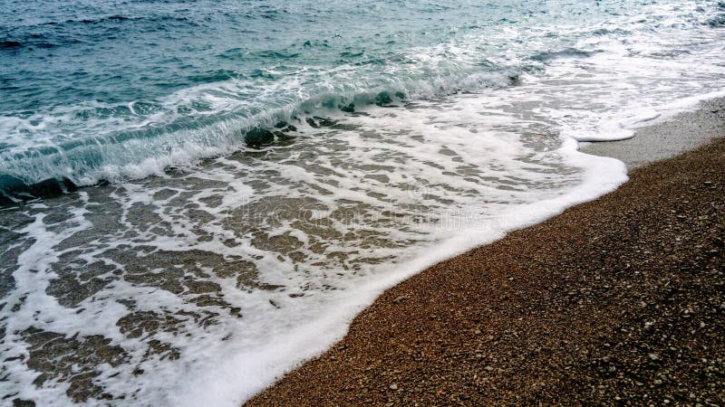 Sea waves on beach close up background. Sea waves on beach close up background.