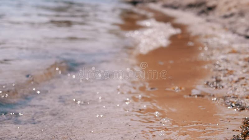 Sea Waves Break on the Sandy Beach. Slow motion