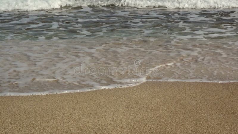 Sea Waves over Sand Beach.