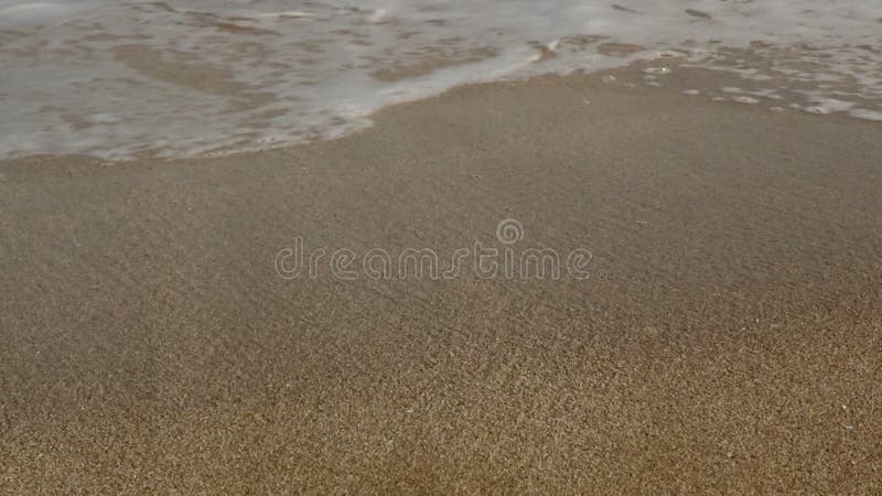 Sea Waves over Sand Beach.