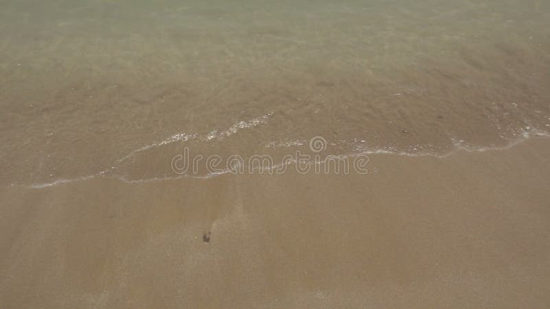 Sea Waves over Sand Beach.