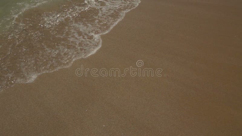 Sea Waves over Sand Beach.