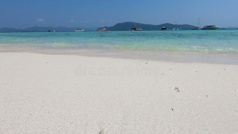 Sea waves over sand beach in tropical beach at Koh Hey