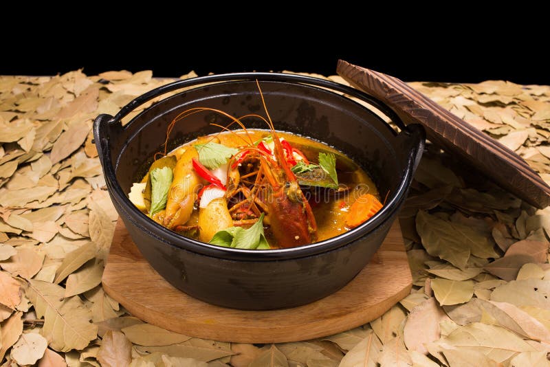 Seafood Coconut Milk Soup with Red Chilli, and Tomato Stock Photo