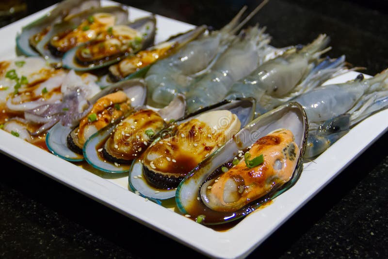 Seafood place on a plate stock image. Image of frozen 85316611