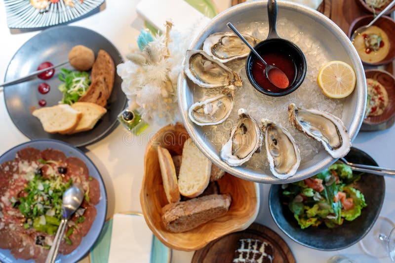 Seafood. Shellfish Mussels. Mussels with Lemon in Shells on Plate. Restaurant Serving Fresh