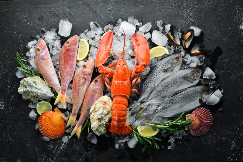 Seafood on Stone Background. Lobster, Fish, Shellfish. Top View Stock