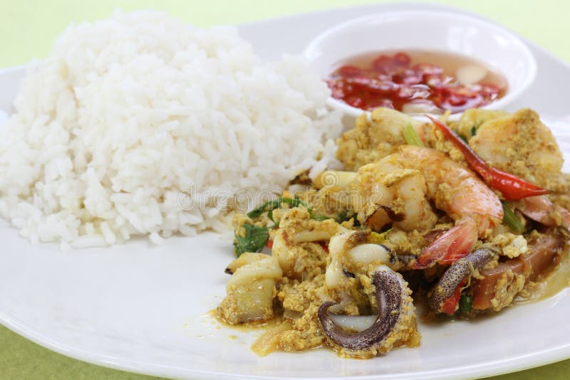 Seafood Yellow Curry Powder Stir Fried with Steam Rice Stock Image