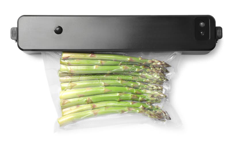Sealer for Vacuum Packing with Plastic Bag of Asparagus on White Background, Top View Stock