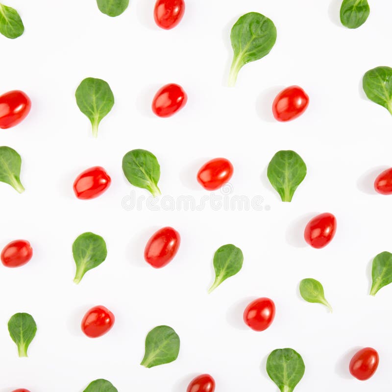 Pattern of basil leaves and tomatoes stock images