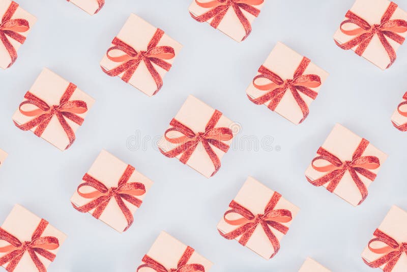 Seamless pattern of craft boxes with red ribbon bows. Valentine royalty free stock photos Seamless pattern of craft boxes with red ribbon bows. Valentine royalty free stock photos