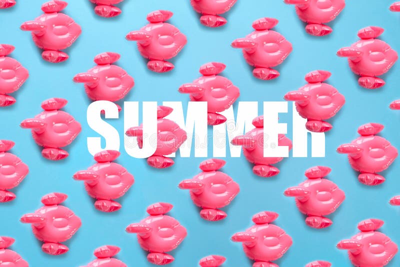 Seamless pattern with Inflatable pink flamingos on a blue background. royalty free stock photography