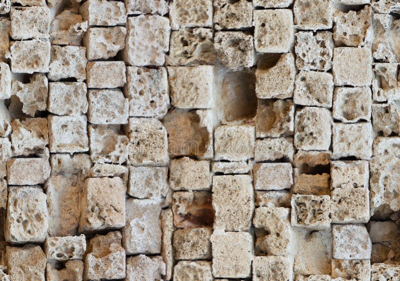 Seamless pattern of partially destroyed masonry wall of limestone blocks. Background texture of weathered ancient brick royalty free stock photo Seamless pattern of partially destroyed masonry wall of limestone blocks. Background texture of weathered ancient brick royalty free stock photo