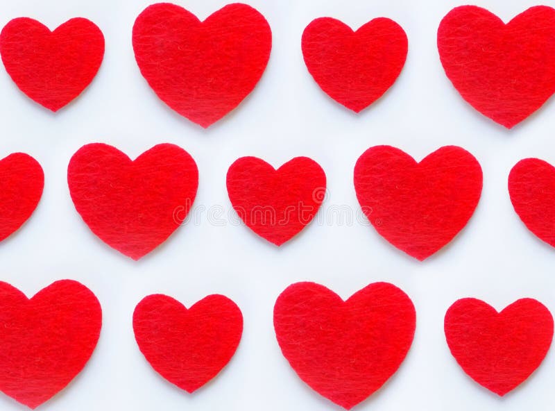 Seamless pattern of red hearts of different shapes on a white background.