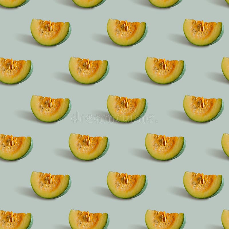 Seamless pattern with pumpkin slice on a gray-green background royalty free stock image Seamless pattern with pumpkin slice on a gray-green background royalty free stock image