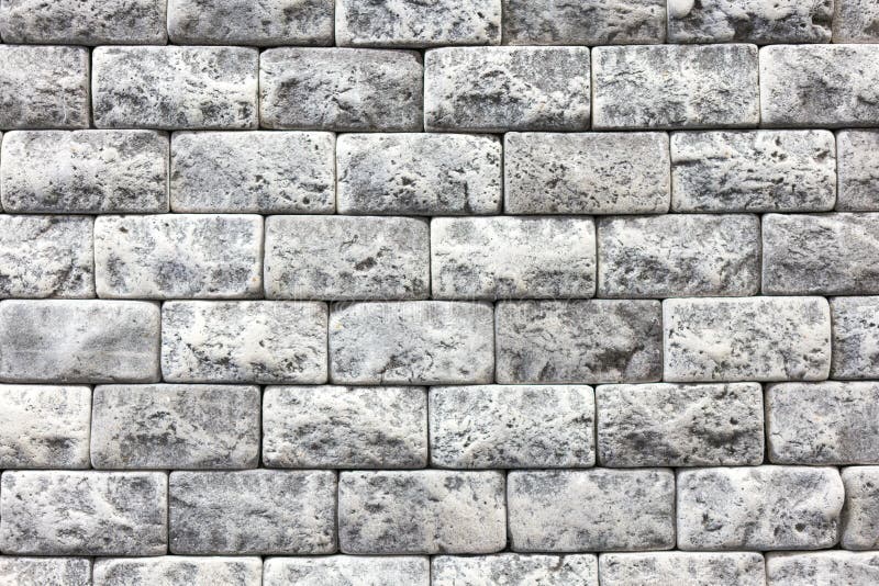 Seamless texture of white decorative stacked stone, natural stone cladding. brick background. close up. Background royalty free stock image