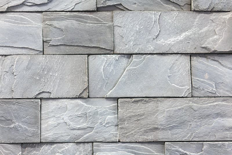 Seamless texture of white decorative stacked stone, natural stone cladding. brick background. close up. Background royalty free stock image