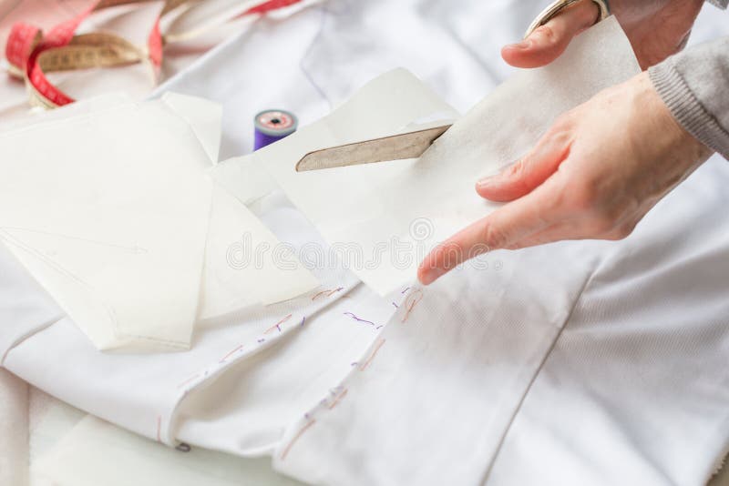 Seamstress is Cutting Drawing for a Dress with Scissors Stock Image ...