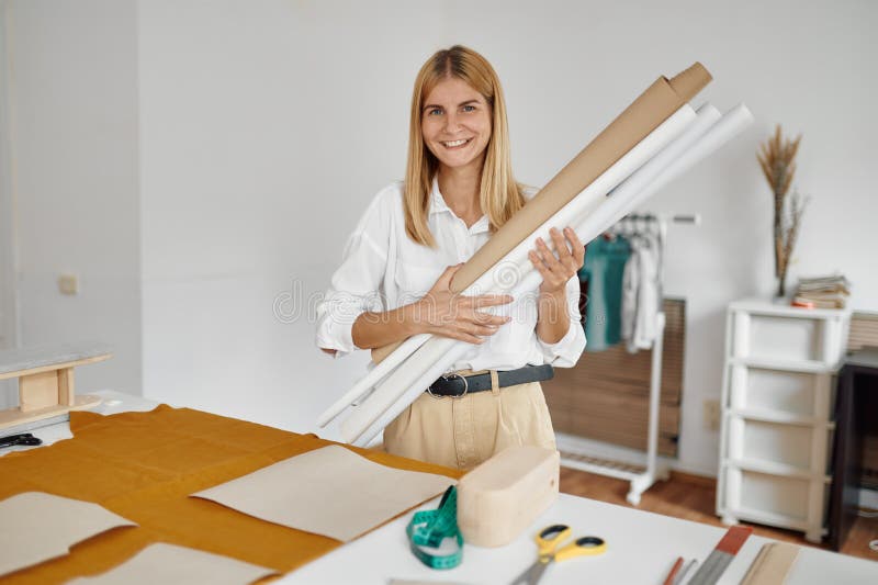 https://thumbs.dreamstime.com/b/seamstress-holds-patterns-her-workplace-workshop-dressmaking-occupation-professional-sewing-handmade-tailoring-business-234888423.jpg